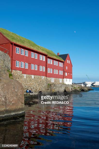 Peninsula Tinganes with old town and the red houses of the government district. Torshavn the capital of the Faroe Islands on the island of Streymoy...