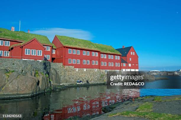 Peninsula Tinganes with old town and the red houses of the government district. Torshavn the capital of the Faroe Islands on the island of Streymoy...