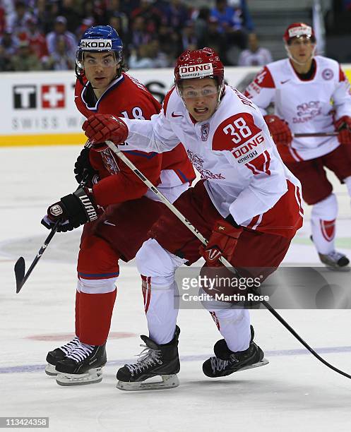 Michael Frolik of Czech Republic skates against Morten Poulsen of Denmark during the IIHF World Championship group D match between Czech Republic and...