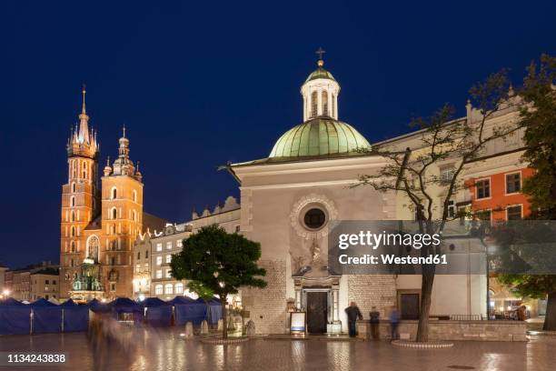 poland, krakow, city at night, st. adalbert church and st. mary's basilica in the old town - krakow stock pictures, royalty-free photos & images