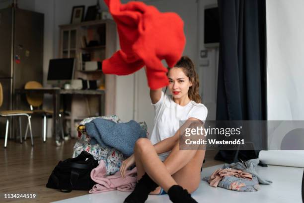 young model in a photo studio, changing clothes - throwing stock pictures, royalty-free photos & images