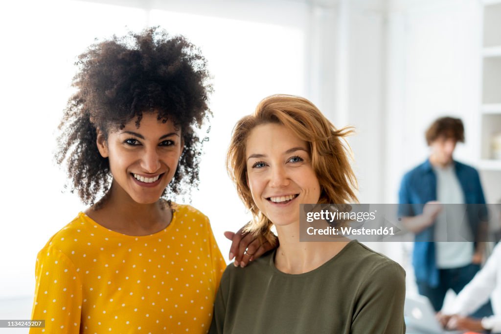 Portraits of colleagues, working together in a coworking space