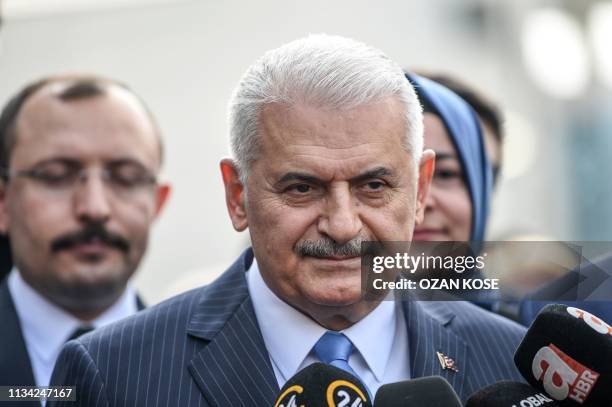 Turkish ruling Justice and Development Party Istanbul mayoral defeated candidate Binali Yildirim speaks to media members as he arrives to the...