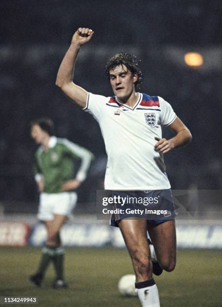 England player Glenn Hoddle celebrates after scoring the 4th goal during the Home International match against Northern Ireland at Wembley Stadium on...