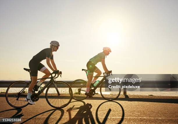 legs speak louder than words - friends cycling stock pictures, royalty-free photos & images