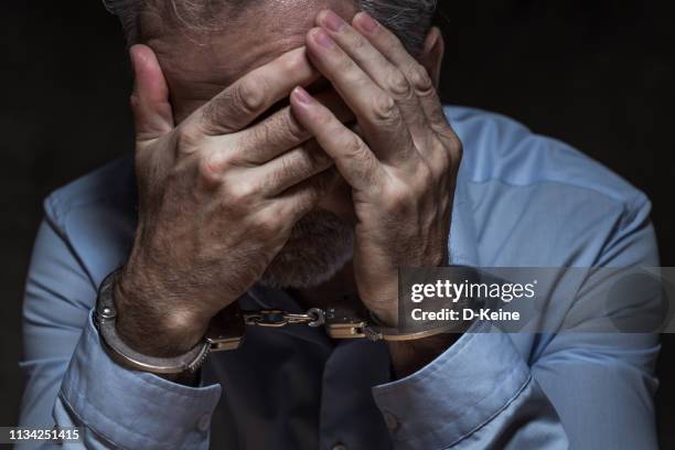 arrested businessman - handcuffs imagens e fotografias de stock