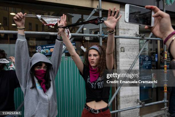 Two young women hold blood-stained panties as they take part to a student demonstration against gender violence and calling for gender parity on...