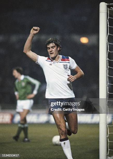 England player Glenn Hoddle celebrates after scoring the 4th goal during the Home International match against Northern Ireland at Wembley Stadium on...