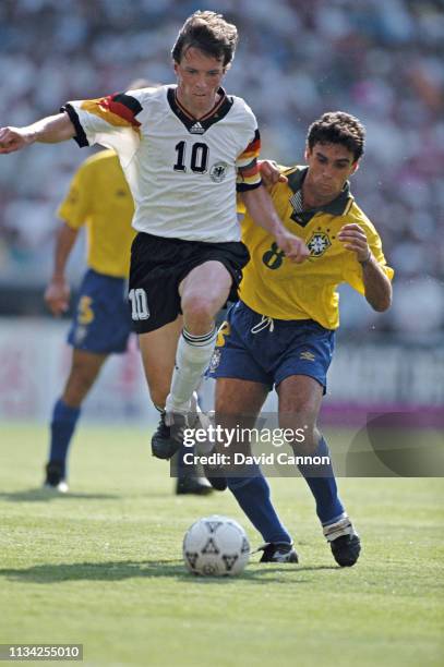 Germany player Lothar Matthaus is challenged by Luisinho of Brazil during the US Cup match at RFK Stadium on June 10, 1993 in Washington DC, North...