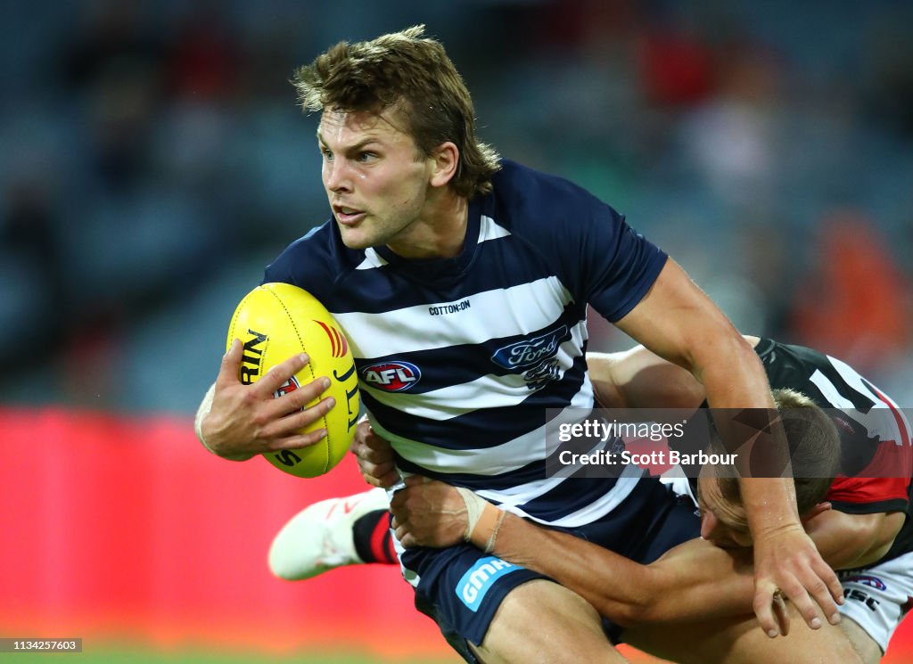 Devon Atkins Tom Atkins of the Cats is tackled by Devon Smith of the Bombers... News ...