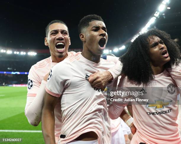 Marcus Rashford of Manchester United celebrates scoring his sides third goal with teammates Chris Smalling and Tahith Chong during the UEFA Champions...