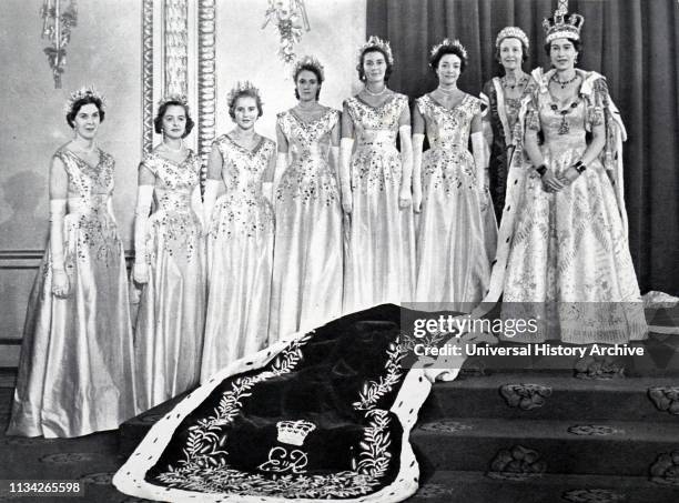 Queen Elizabeth II with her Mistress of the Robes and the six Maids of Honour after her coronation. 1953.