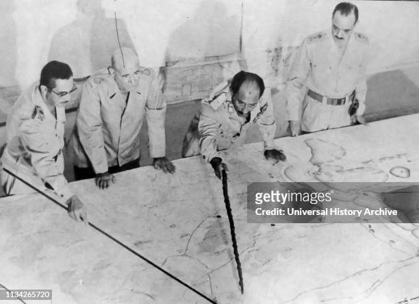 Anwar el-Sadat President of Egypt. At Military HQ during the 1973 Arab-Israeli War. He is accompanied by Field Marshall Ahmed Ismail and General...