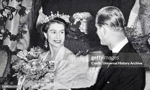 Queen Elizabeth II and the Duke of Edinburgh before the curtain rose for the Gala Performance at London's Old Vic Theatre 1953.