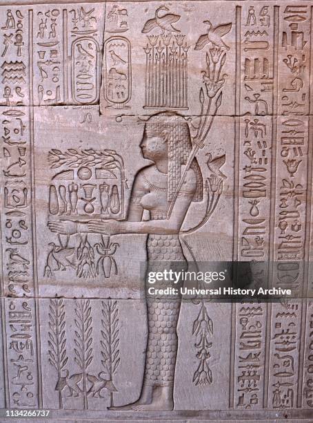Carving at the Temple of Hathor, Dendera, Egypt. The Goddess Neth, Neith , an early goddess in the Egyptian pantheon, said to be the first and the...