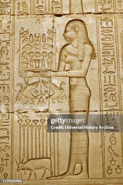Carving at the Temple of Hathor, Dendera, Egypt. The Goddess Neth, Neith , an early goddess in the Egyptian pantheon, said to be the first and the...