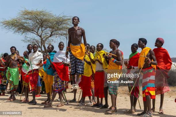 Group of young Samburu men dressed in traditional clothing performing a traditional jumping dance at a Samburu village near Samburu National Reserve...