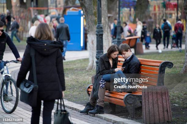 Couple is seen in Mariinskiy Park on a pleasant Spring day in Kyiv, Ukraine on March 30, 2019.