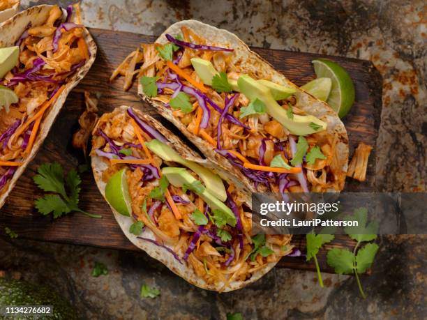 bbq pulled jack fruit taco - stuffed avocado stock pictures, royalty-free photos & images