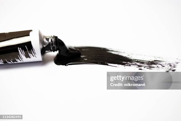 black gouache/ acrylic paint on paper mixed and paint tube - gouache stock pictures, royalty-free photos & images