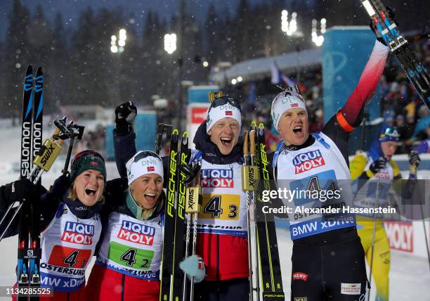 Marte Olsbu Roeiseland, Tiril Eckhoff, Johannes Thingnes Boe and Vetle Sjaastad Christiansen of Norway celebrate winning the gold medal after the IBU...