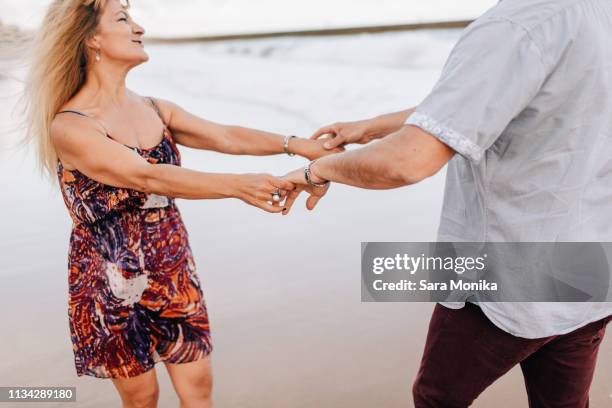 couple enjoying beach - 2 peas in a pod stock pictures, royalty-free photos & images