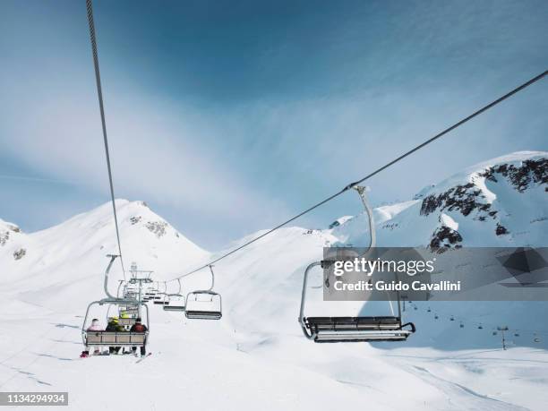 ski lift in snow covered mountain landscape,  alpe ciamporino, piemonte, italy - piemonte - fotografias e filmes do acervo