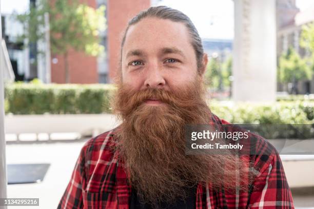 male hipster with long beard - long beard stockfoto's en -beelden