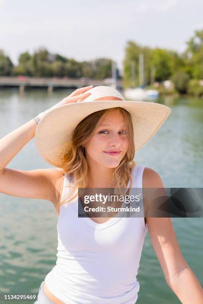 young woman on sailboat, portrait, chiemsee lake, bavaria, germany - água parada imagens e fotografias de stock