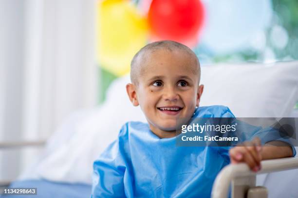 young boy in hospital laughing - childhood cancer stock pictures, royalty-free photos & images