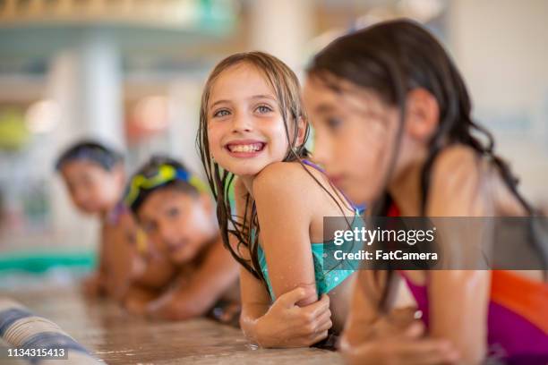 kids at the side of the pool - aquafit stock pictures, royalty-free photos & images