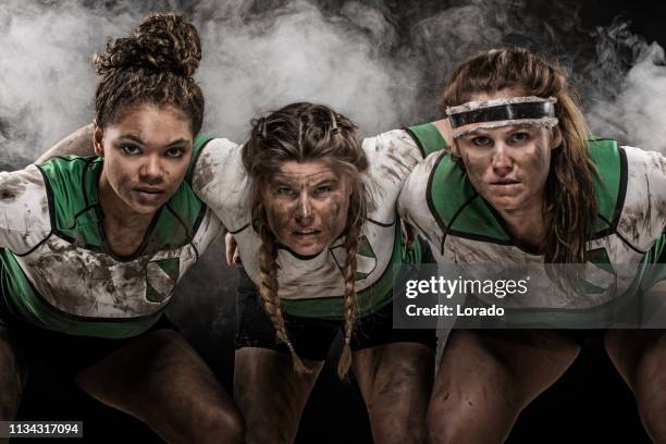 drei weibliche rugby-spieler - women's rugby stock-fotos und bilder