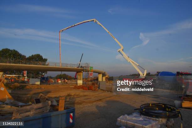 contractor at work - cement mixer truck stock pictures, royalty-free photos & images