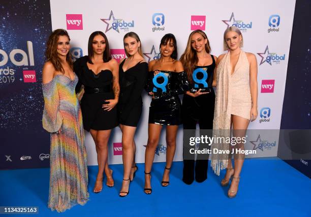 Cheryl and Anne Marie present Jesy Nelson, Perrie Edwards, Leigh-Anne Pinnock, Jade Thirlwall of Little Mix with the Best Group Award at the The...