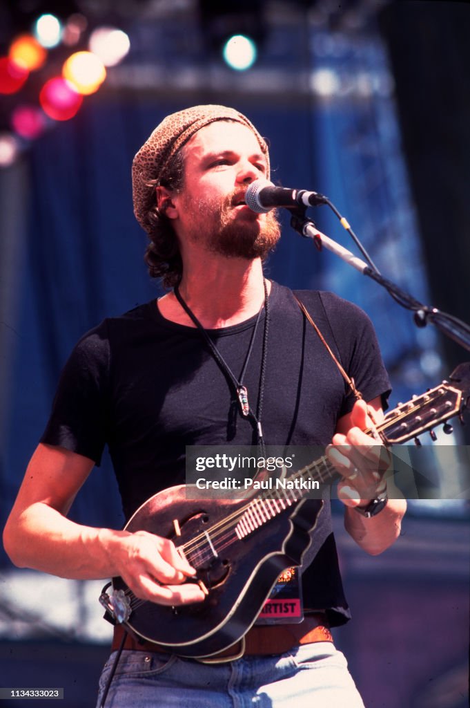 Rusted Root Singer Michael Glabicki of Rusted Root performs on stage at Farm Aid in ...