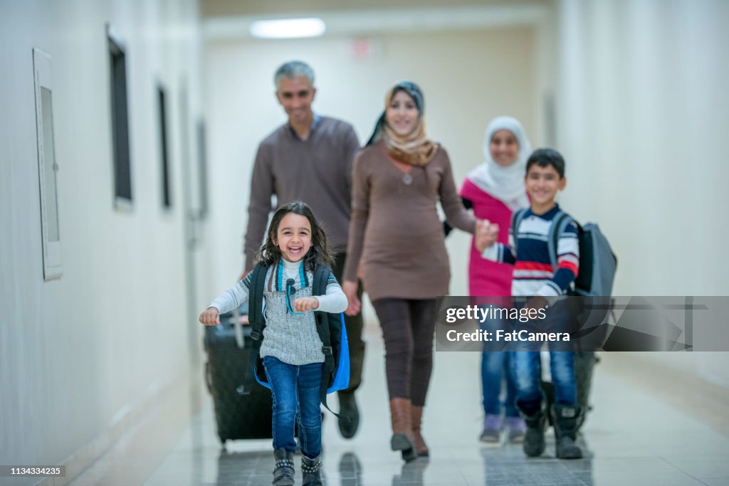 Muslim family waiting to leave