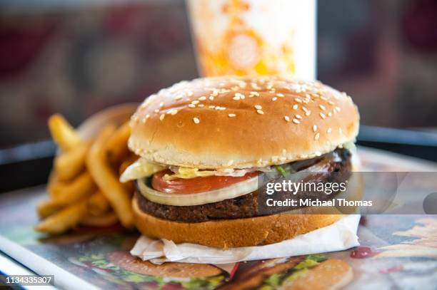 In this photo illustration, an 'Impossible Whopper' sits on a table at a Burger King restaurant on April 1, 2019 in Richmond Heights, Missouri....