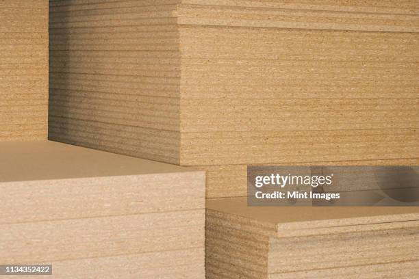 stacks of plywood - triplex stockfoto's en -beelden