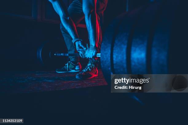 man practicing weightlifting - weight training stock pictures, royalty-free photos & images