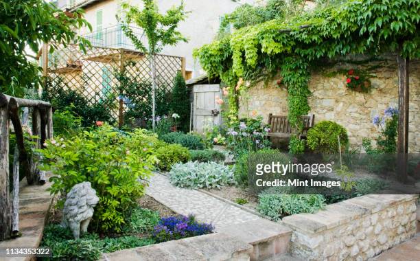 patio garden - stone house stock pictures, royalty-free photos & images