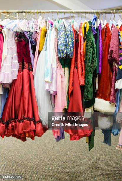 costumes on a rack - stage costume stock pictures, royalty-free photos & images