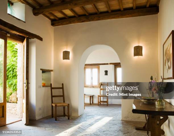 archway in foyer of luxury villa - brick house stock pictures, royalty-free photos & images