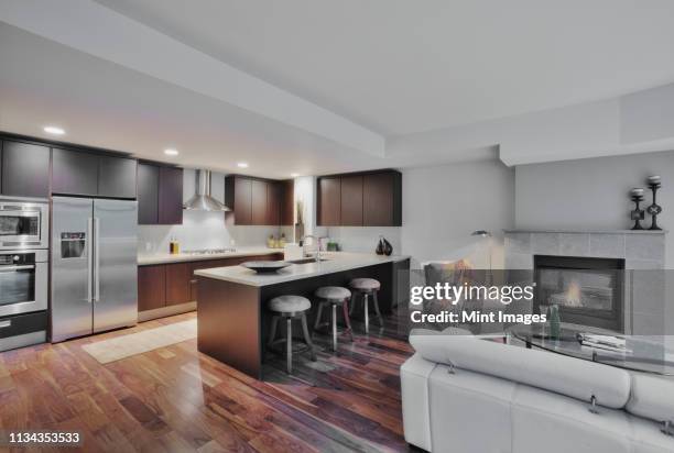 luxury kitchen and living room - kitchen ceiling lights stock pictures, royalty-free photos & images