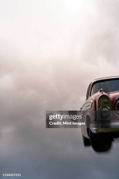 vintage car in the sky - car mid air stock pictures, royalty-free photos & images