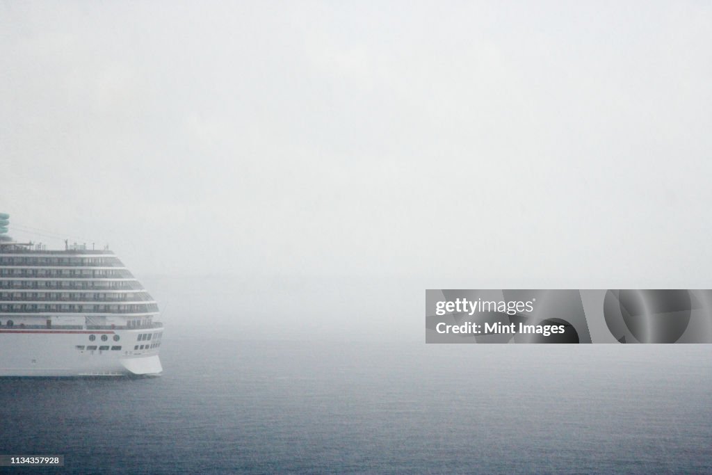 Cruise ship in fog on ocean