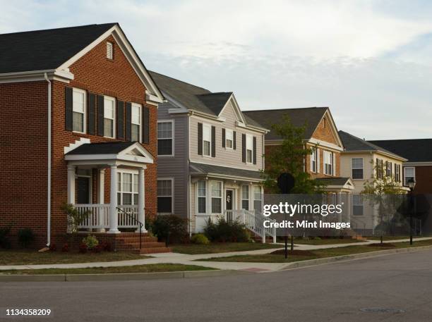 neighborhood homes on street corner - us house foto e immagini stock
