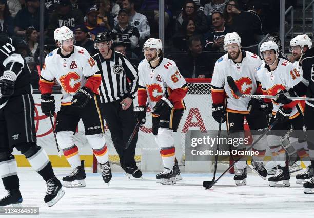 James Neal, Michael Frolik, Oscar Fantenberg, and Derek Ryan of the Calgary Flames celebrate Neal's third-period goal during the game against the Los...