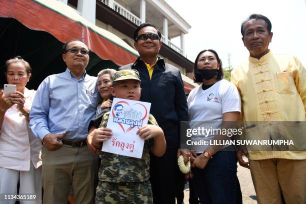 Thai Prime Minister Prayut Chan-O-Cha poses with supporters at Wat Bupparam temple in the northern Thai province of Chiang Mai on April 2, 2019.