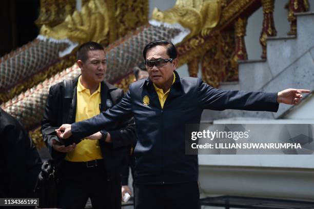 Thai Prime Minister Prayut Chan-O-Cha leaves Wat Bupparam temple after overseeing a Buddhist ceremony to prepare sacred water for the royal...