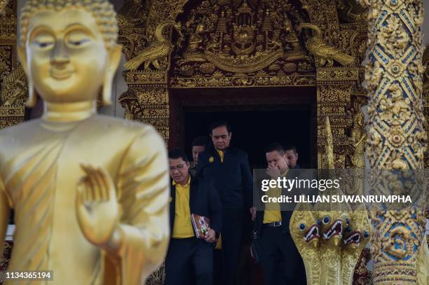 Thailand's Prime Minister Prayut Chan-O-Cha pays his respect at Wat Bupparam temple to oversee a Buddhist ceremony to prepare sacred water for the...